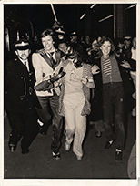thumbnail link to original 1973 press photo David Bowie chased at Charing Cross station.