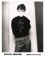 thumbnail link to original David Bowie RCA 1977 photo, Sukhita Heroes shot, leather jacket on backwards